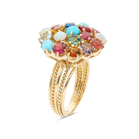 Multi gemstone cluster ring, side  view.