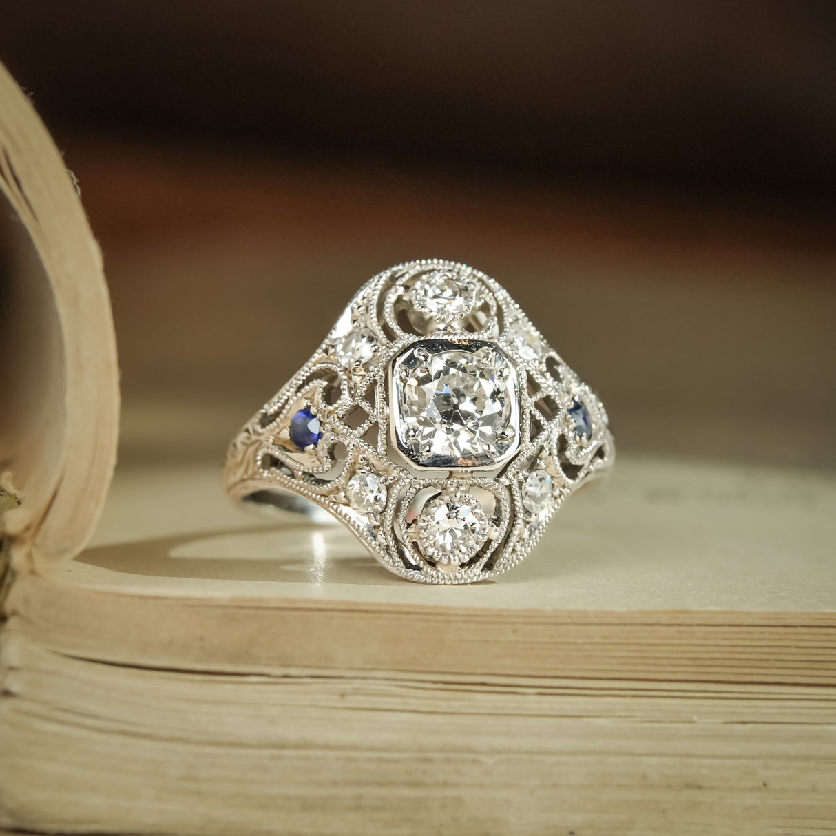 Antique diamond and sapphire cluster ring in Art Deco style