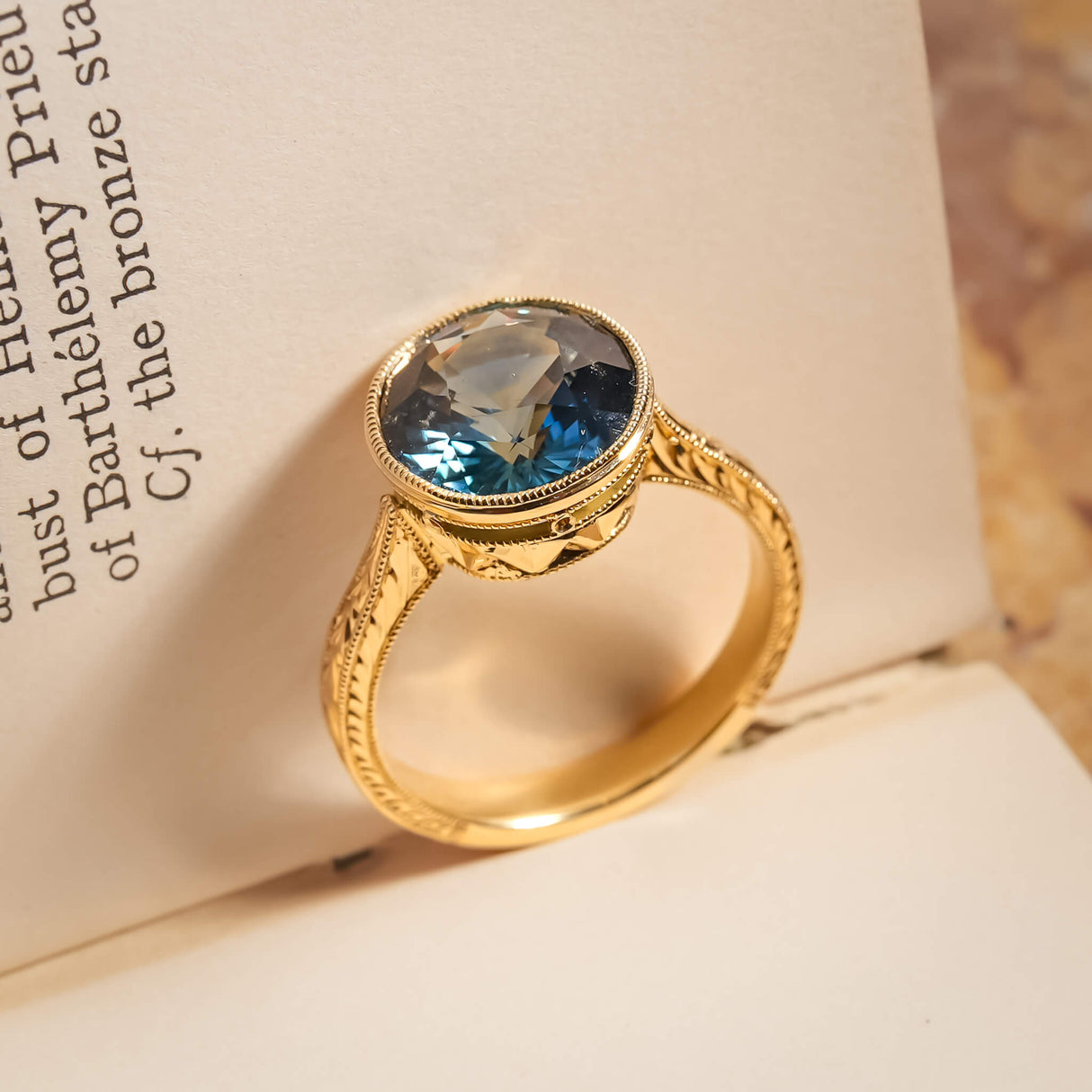 5.70ct Caribbean blue green sapphire solitaire ring in yellow gold