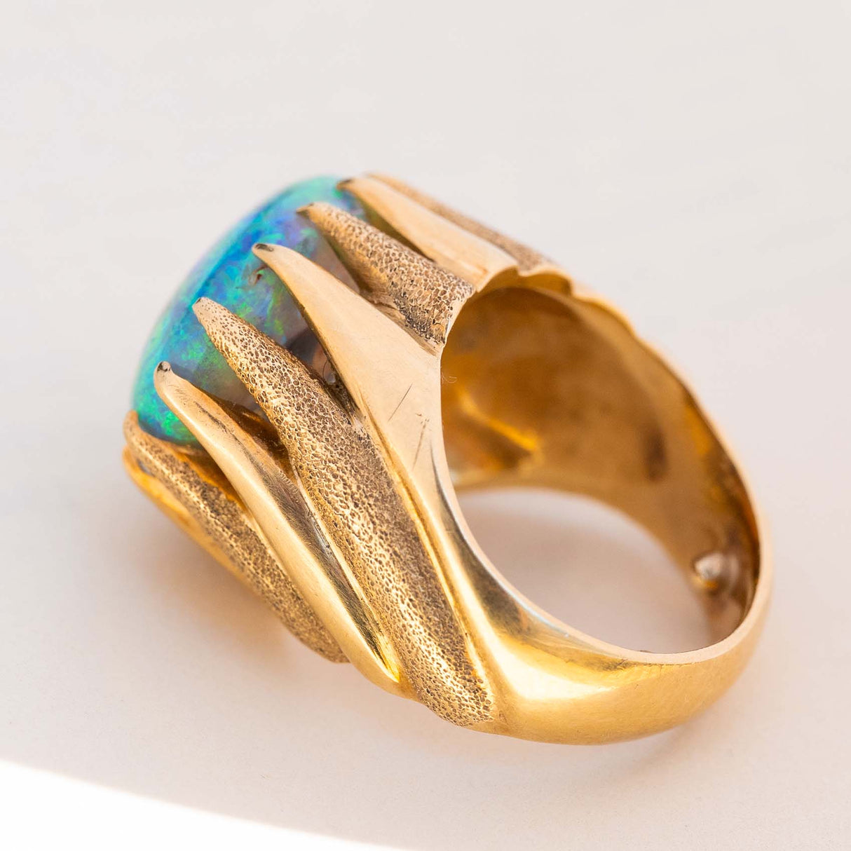 Gallery view of a vintage 1970s cabochon Australian opal ring in yellow gold.