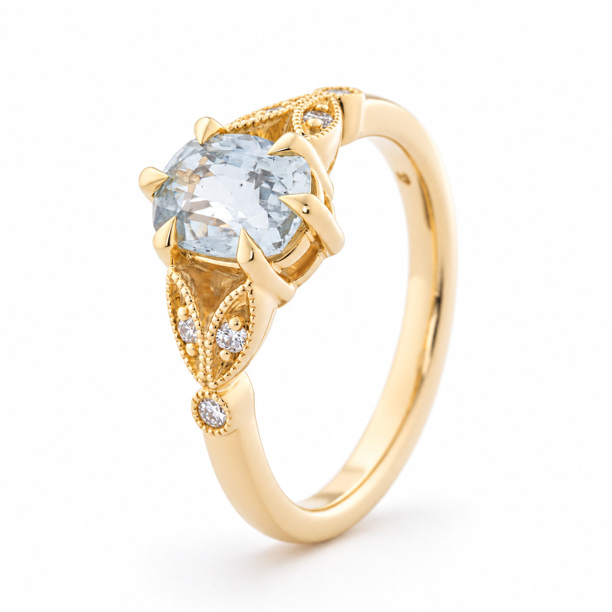 Angled view of the white sapphire engagement ring, highlighting the intricate gold leaf detailing, diamond accents and raised claw setting.
