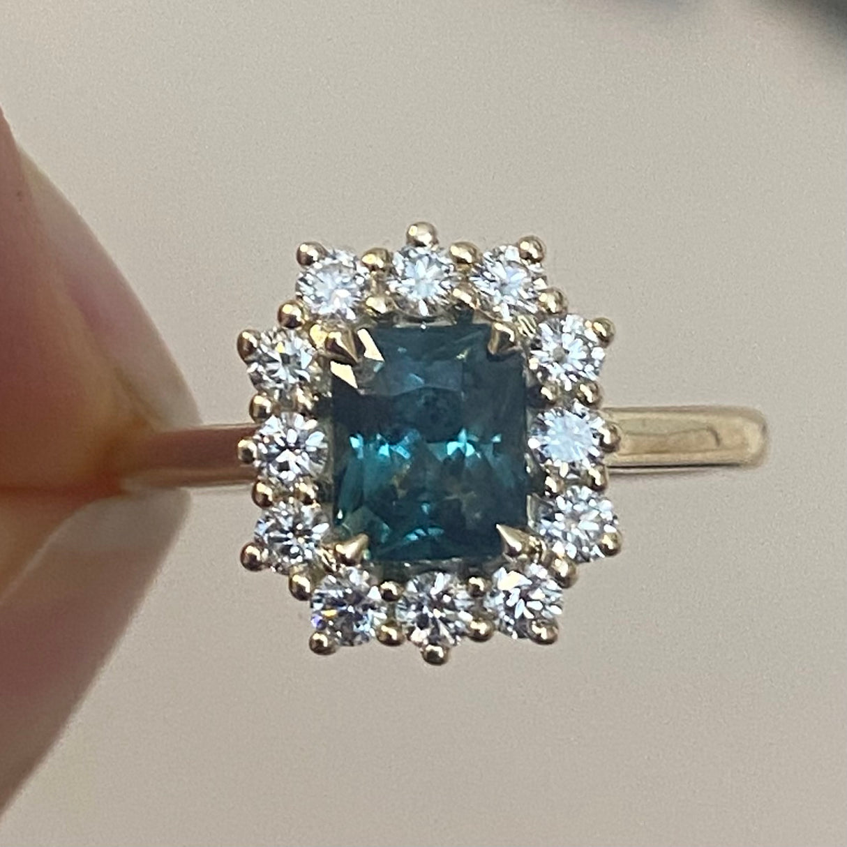 Green sapphire and diamond cluster ring