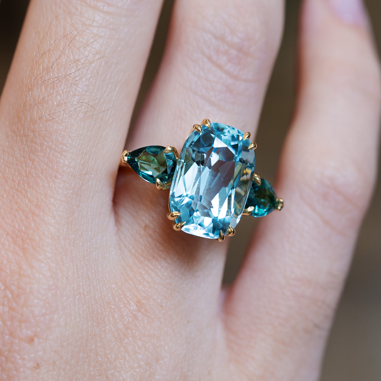 Aquamarine and sea-green tourmaline three-stone cocktail ring