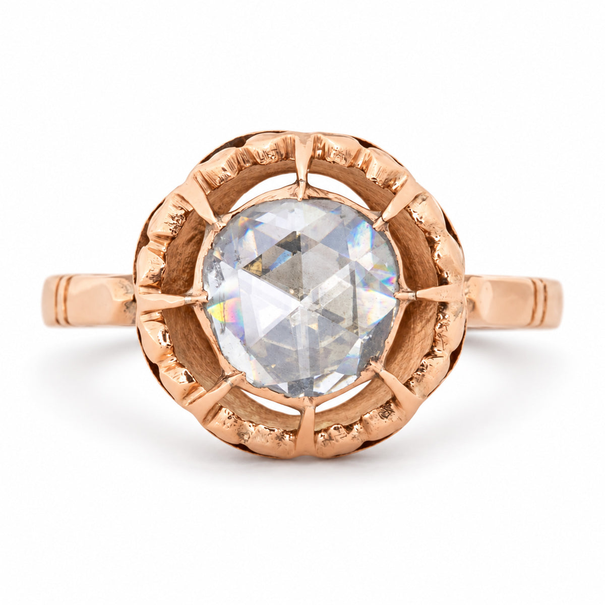 Antique Victorian solitaire ring featuring a large rose-cut diamond in an ornate openwork setting of warm 12ct yellow gold.