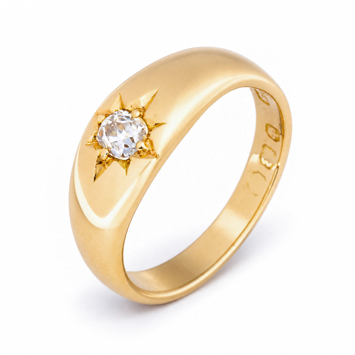 Elevated studio view of the Victorian gypsy ring, showcasing its substantial tapered band and star-set diamond.