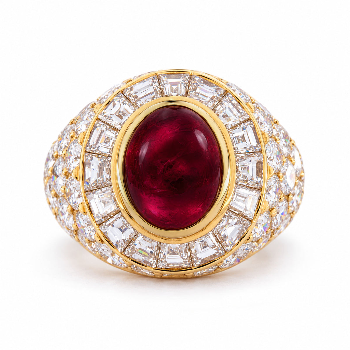 Vintage Asprey cocktail ring in yellow gold, centred with an oval cabochon ruby and surrounded by tapered step-cut and round brilliant diamonds.
