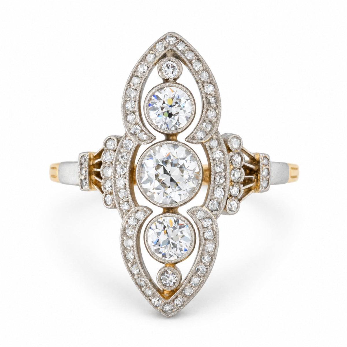 Front view of an antique Art Nouveau diamond cluster ring, featuring a vertical arrangement of old-cut diamonds within an elongated, diamond-set platinum design.