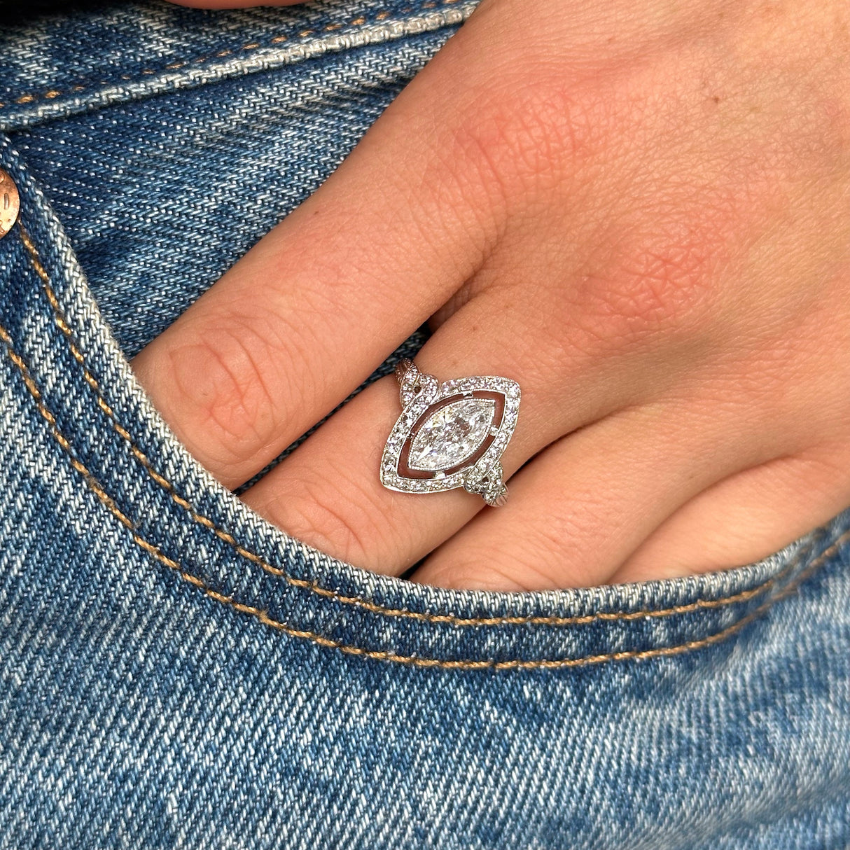 Vintage tiffany & co diamond ring, worn on hand in pocket of jeans.