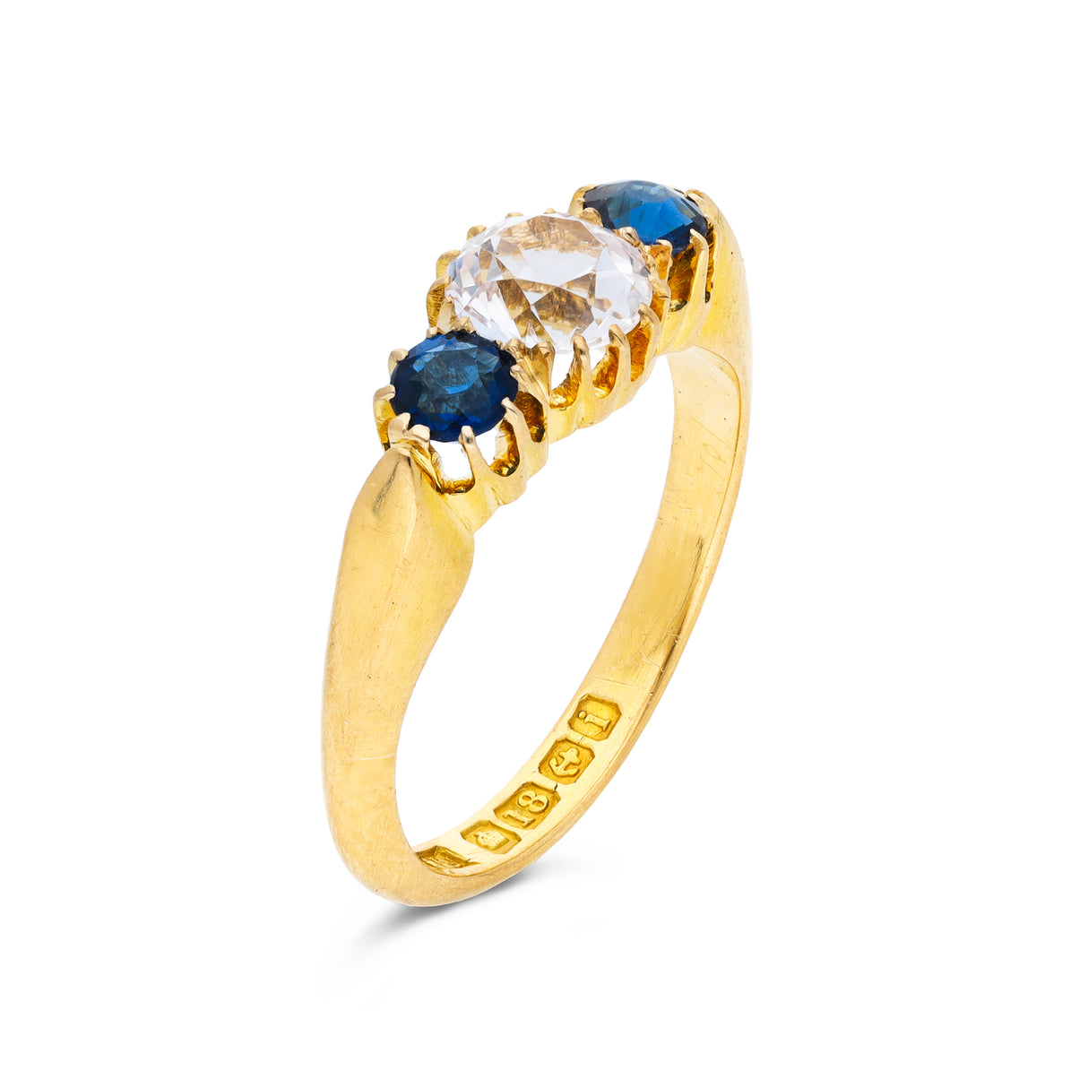 Antique, central white sapphire and blue sapphire three stone ring, 18ct yellow gold