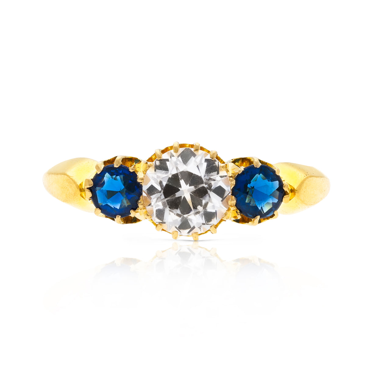 Antique, central white sapphire and blue sapphire three stone ring, 18ct yellow gold