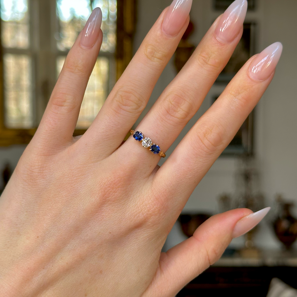 Antique, Edwardian Diamond and Sapphire Engagement Ring, 18ct Yellow Gold worn on hand.