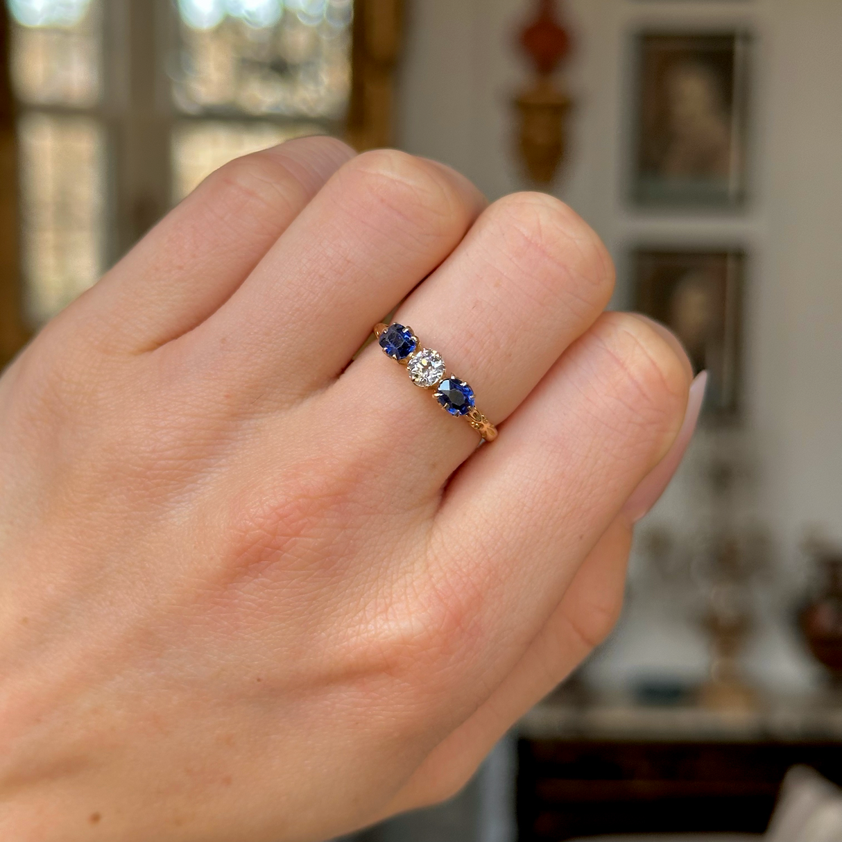 Antique, Edwardian Diamond and Sapphire Engagement Ring, 18ct Yellow Gold worn on closed hand. 