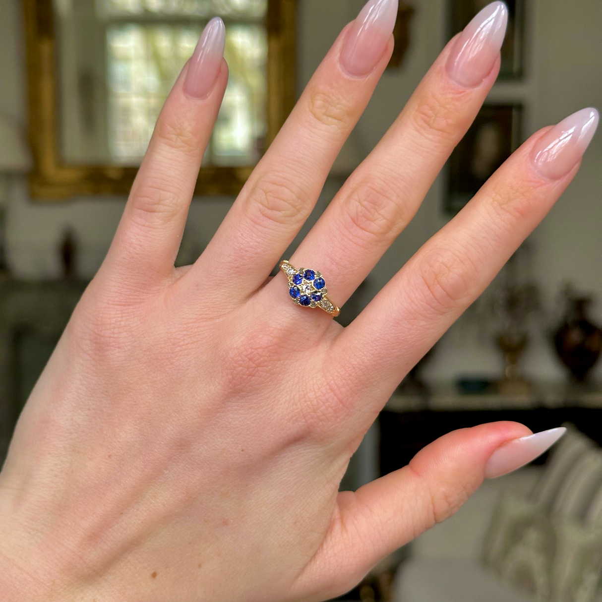 Antique, Edwardian Sapphire and Diamond Cluster Ring, worn on hand.