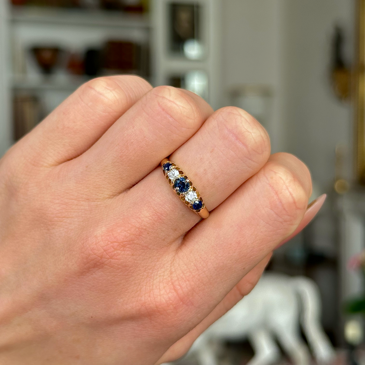 Antique, Edwardian Sapphire and Diamond Five Stone Ring, 18ct Yellow Gold worn on closed hand.