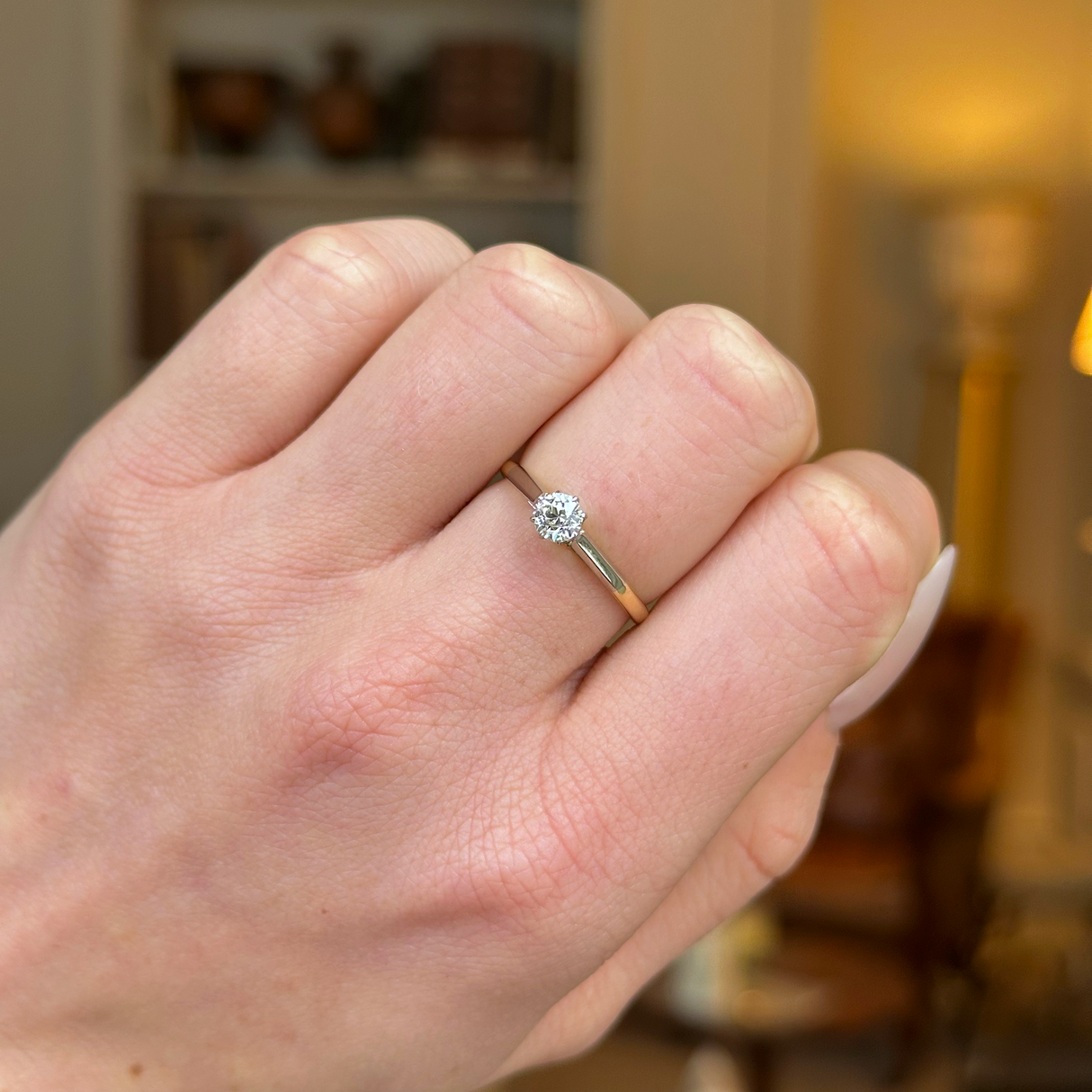 Antique, Edwardian Solitaire Diamond Engagement Ring, 18ct Yellow Gold and Platinum worn on closed hand.