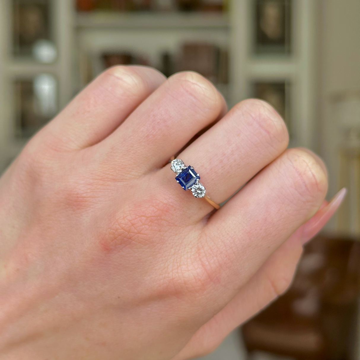 Antique, Edwardian Sapphire and Diamond Three-Stone Engagement Ring, 18ct Yellow Gold and Platinum worn on closed hand.