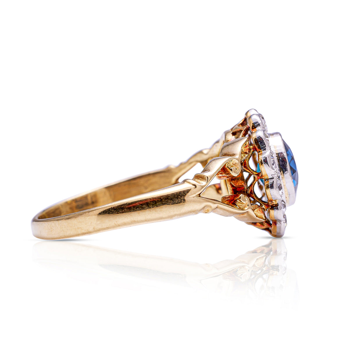 Antique sapphire diamond cluster ring, side view.