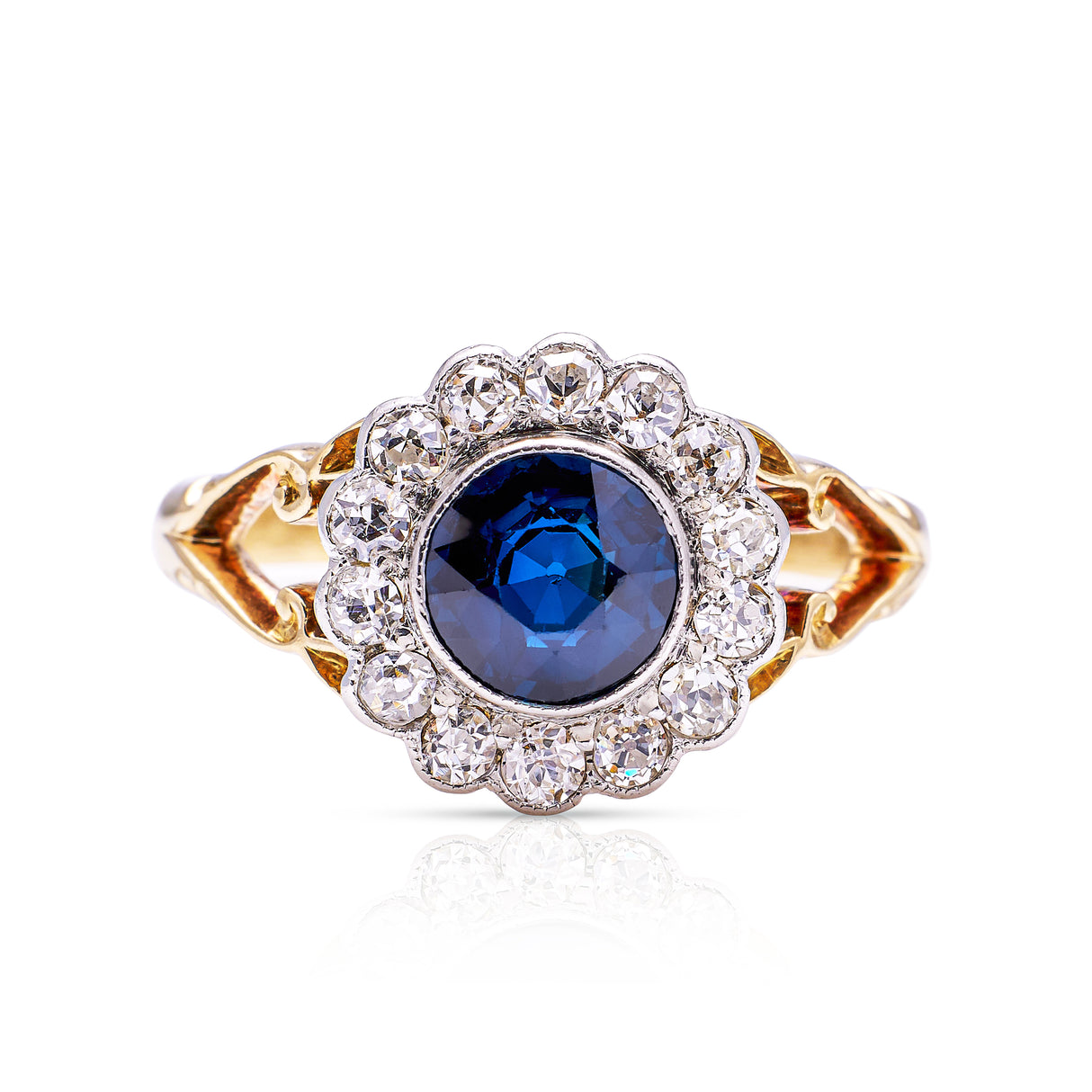 Antique sapphire diamond cluster ring, front view.