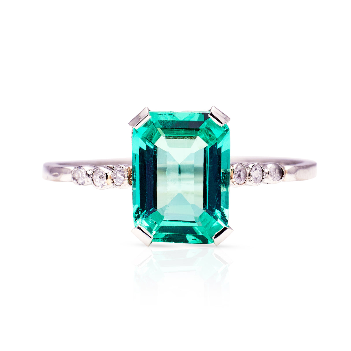 Antique single stone emerald and diamond ring, front view.