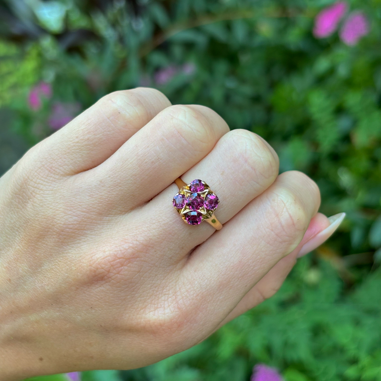 Antique, Victorian garnet five-stone ring, 18ct yellow gold worn on closed hand.