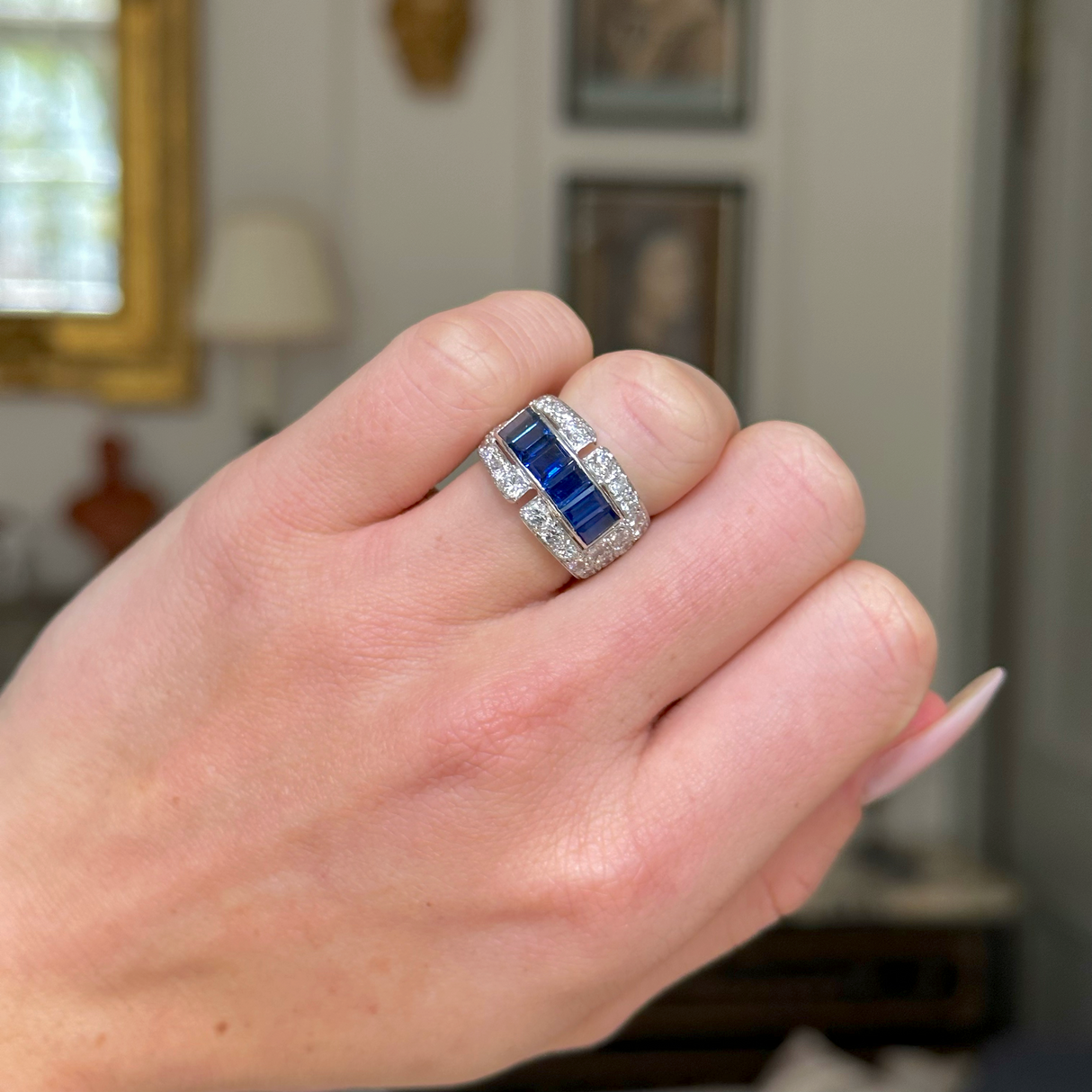 Sapphire and diamond Art Deco Band, worn on closed hand, frontview.