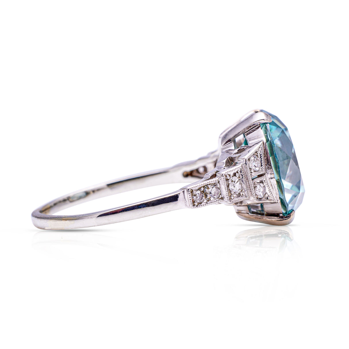 Art deco blue zircon and diamond ring, side view.