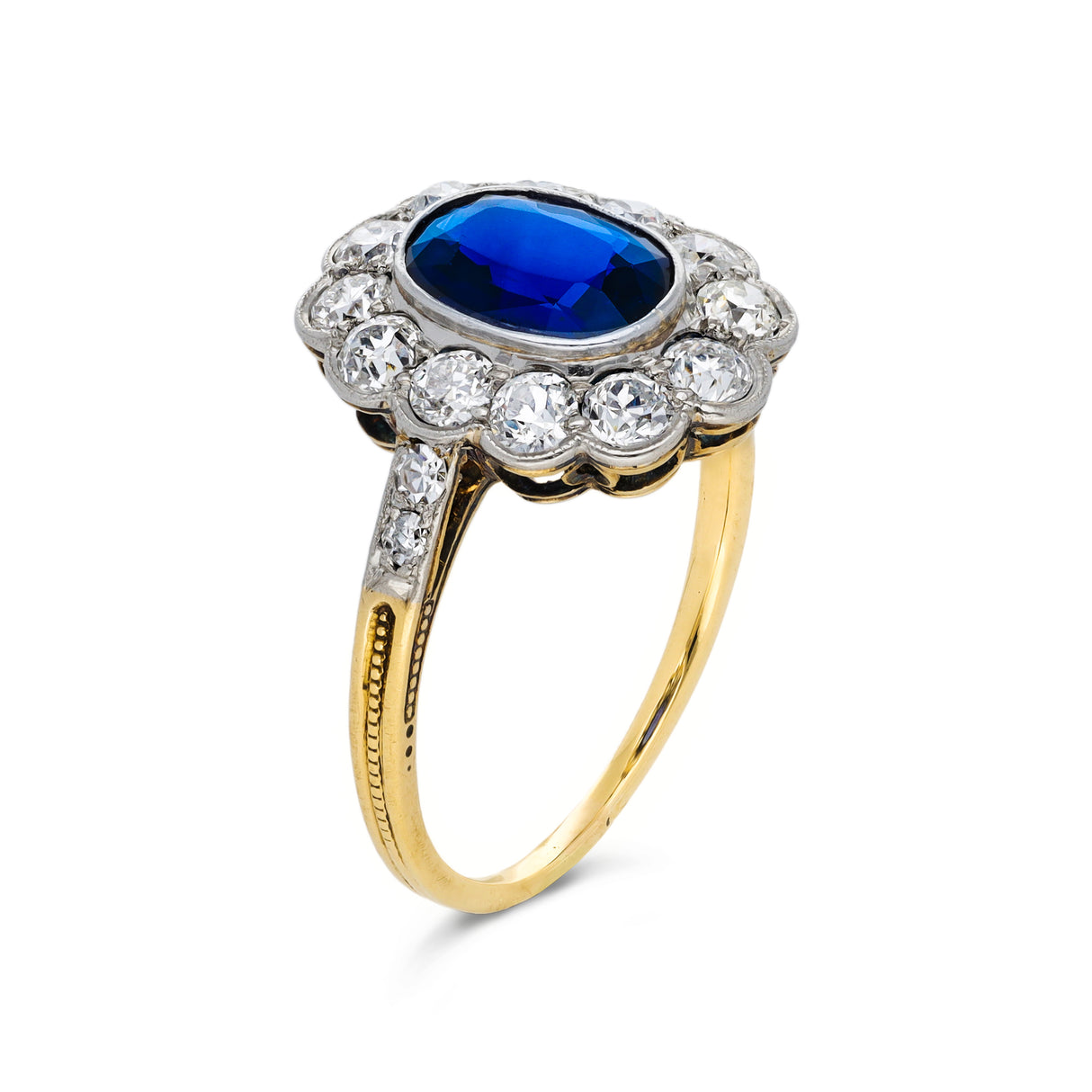 Antique royal blue sapphire and diamond cluster engagement ring, circa 1900
