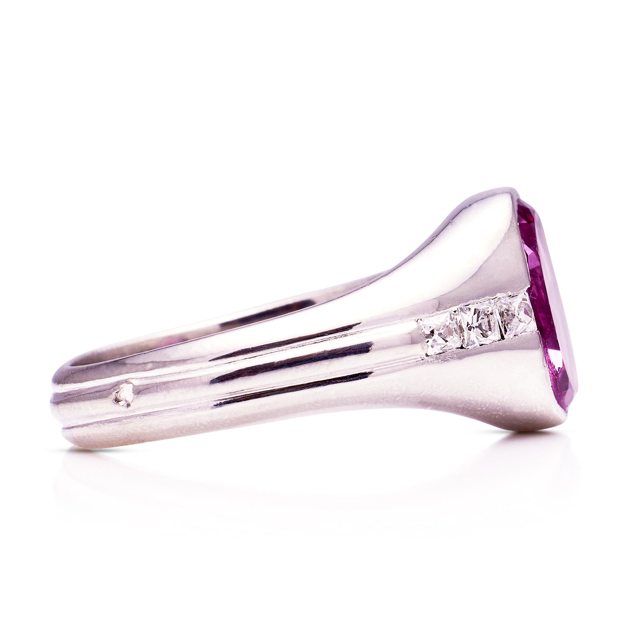 Art Deco vintage pink sapphire and diamond ring, side view.