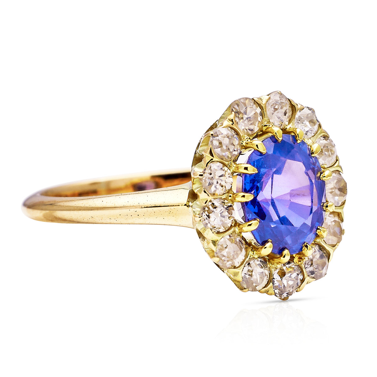 Antique, colour change oval sapphire and diamond cluster engagement ring