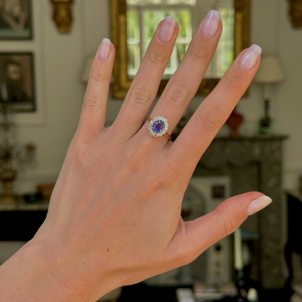 Antique, colour change oval sapphire and diamond cluster engagement ring