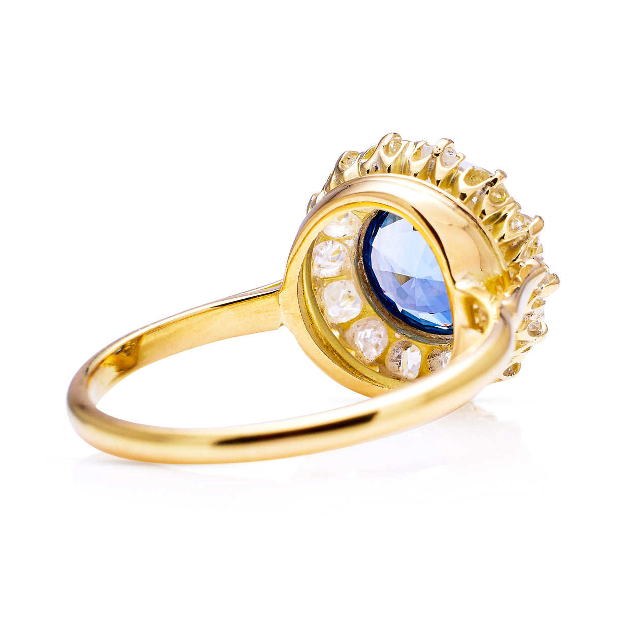 Cornflower blue sapphire and diamond cluster ring, rear view.