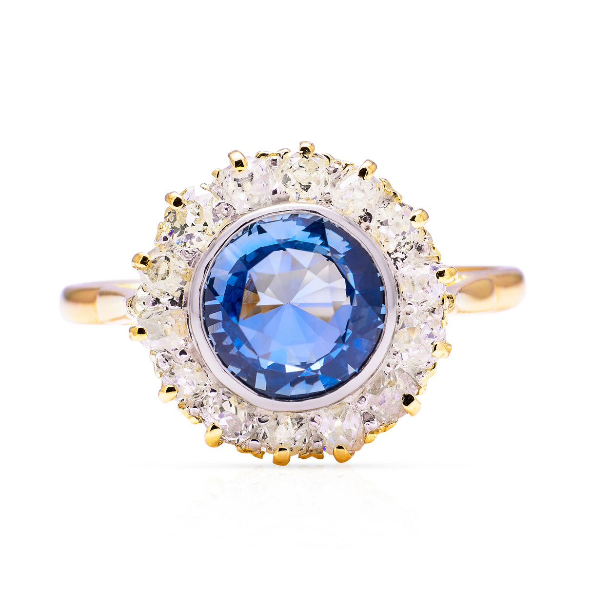 Cornflower blue sapphire and diamond cluster ring, front view.