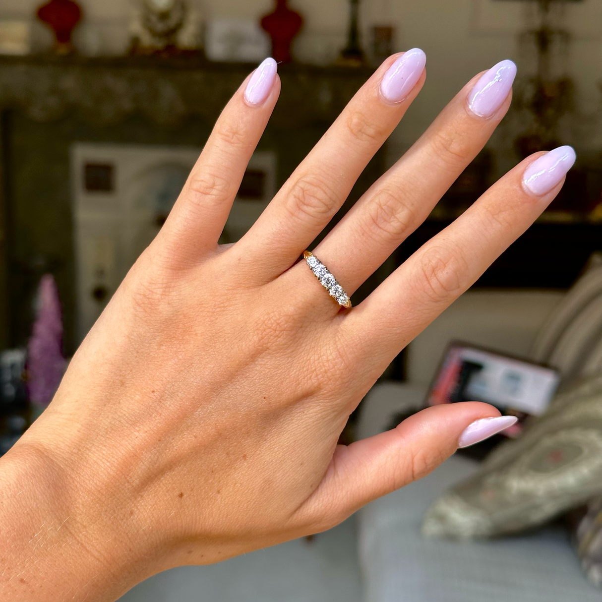 Edwardian diamond and 18ct yellow gold half hoop ring, worn on hand, front view.