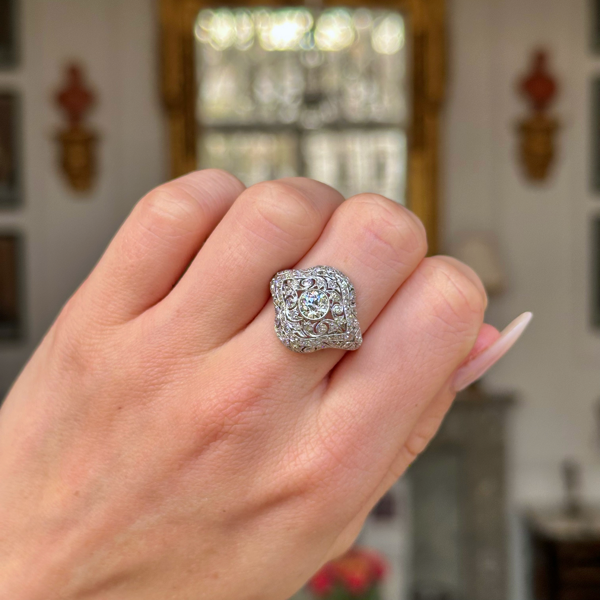 edwardian diamond bombe ring worn on closed hand.