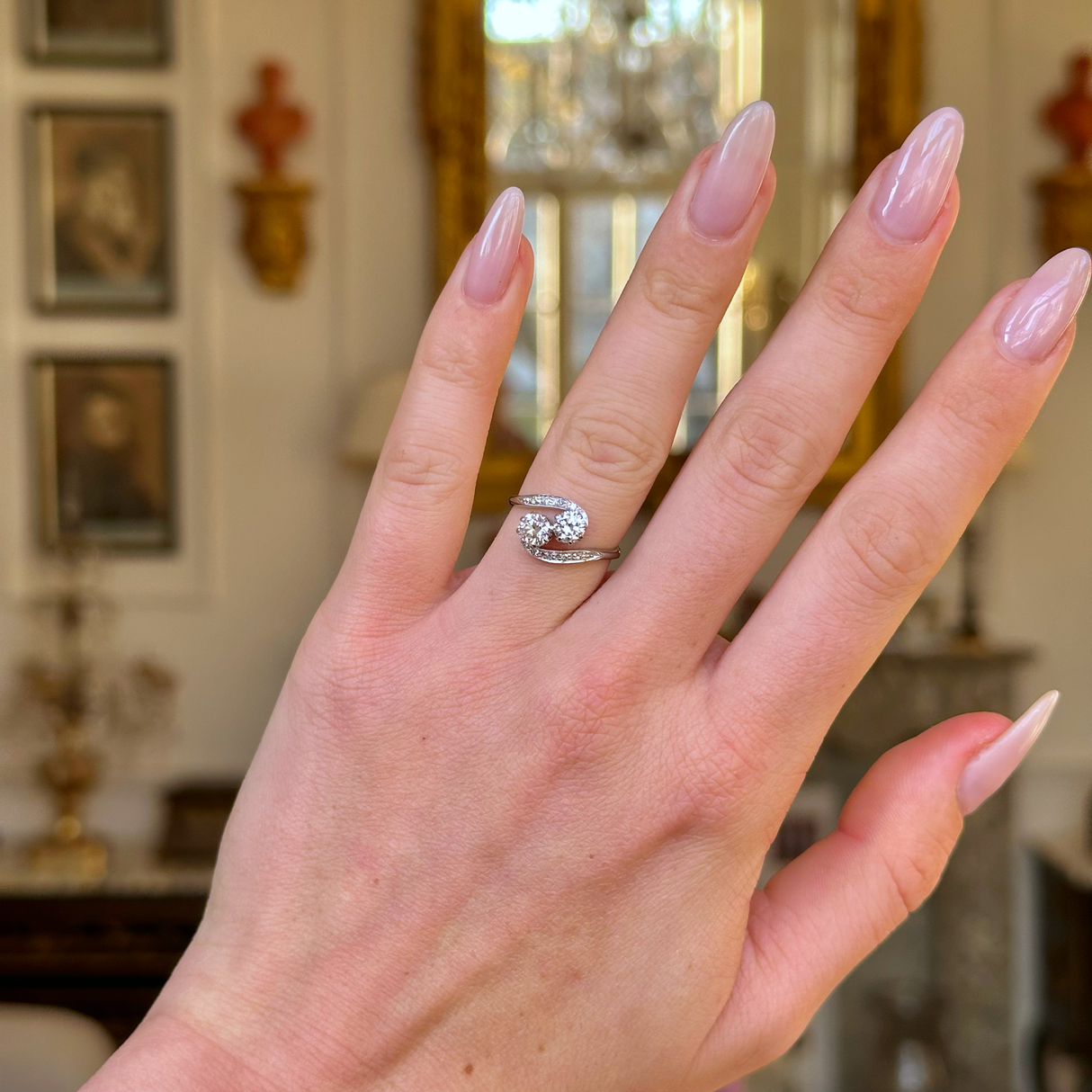 edwardian diamond toi et moi ring worn on hand.