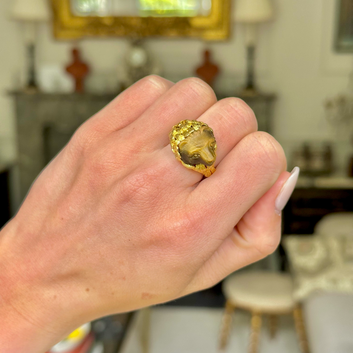 Unusual tiger's eye honey bear and yellow gold ring, worn on hand.