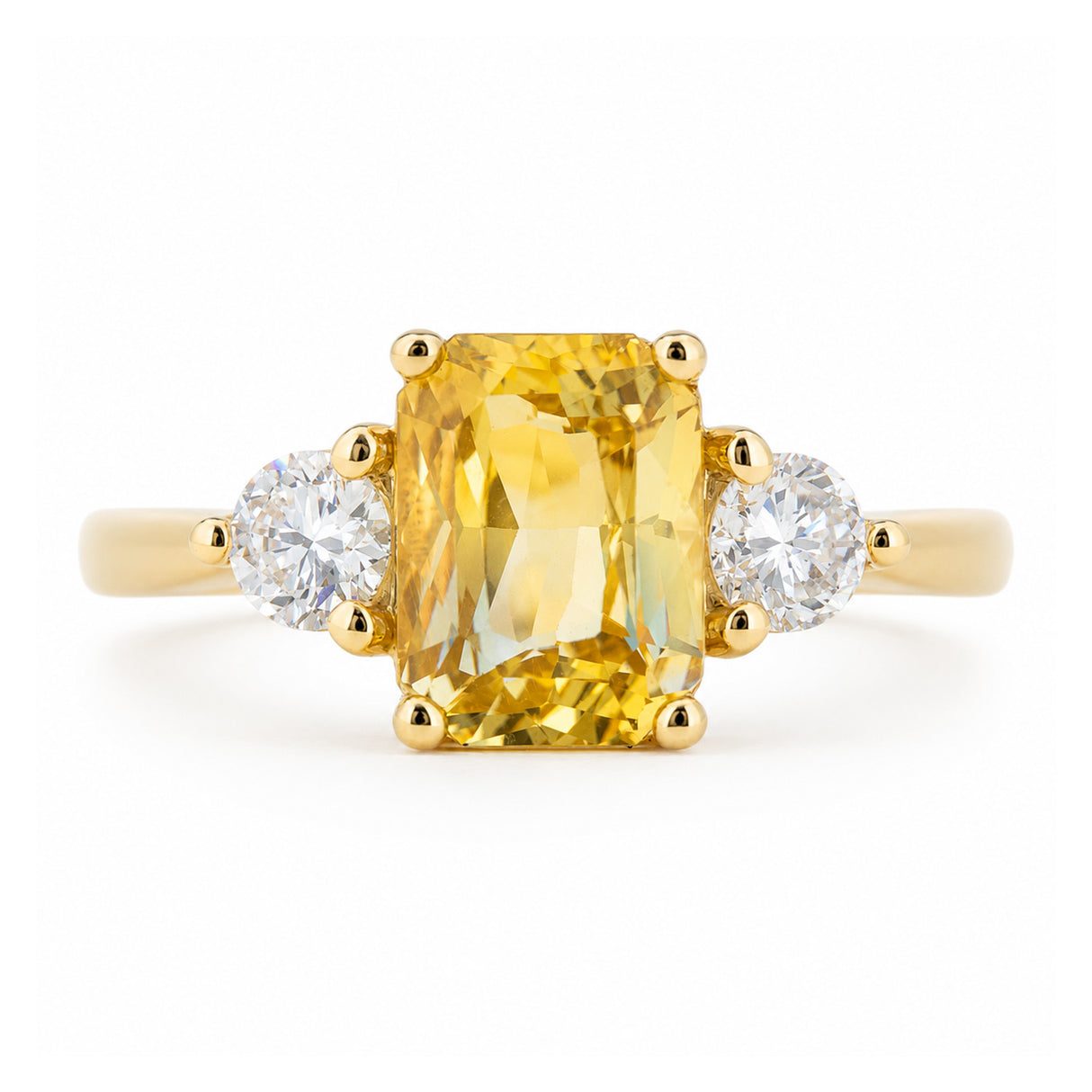 Antique-inspired, yellow sapphire and diamond three-stone engagement ring