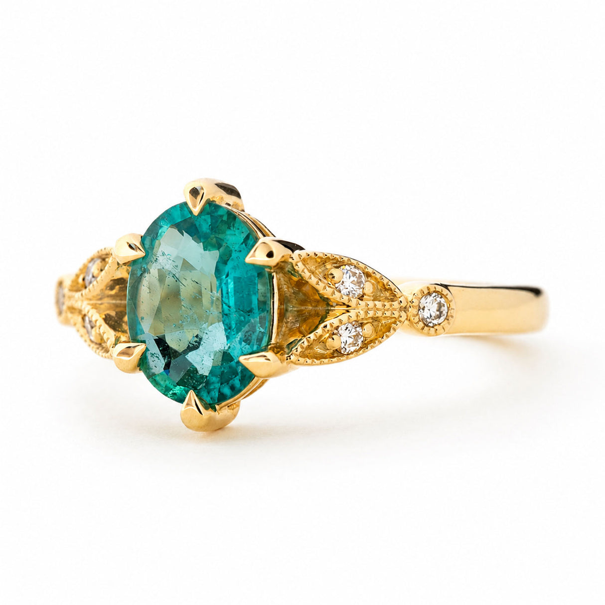 Vintage-inspired, Emerald and diamond engagement ring yellow gold white background angle