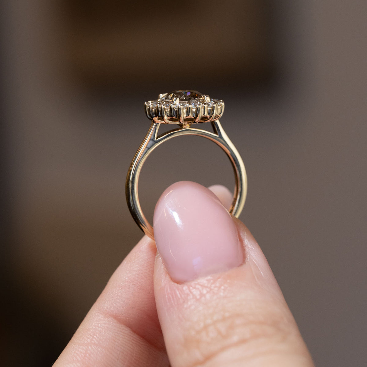 Side profile of the antique-inspired diamond cluster ring, revealing the raised gallery and polished yellow gold band.