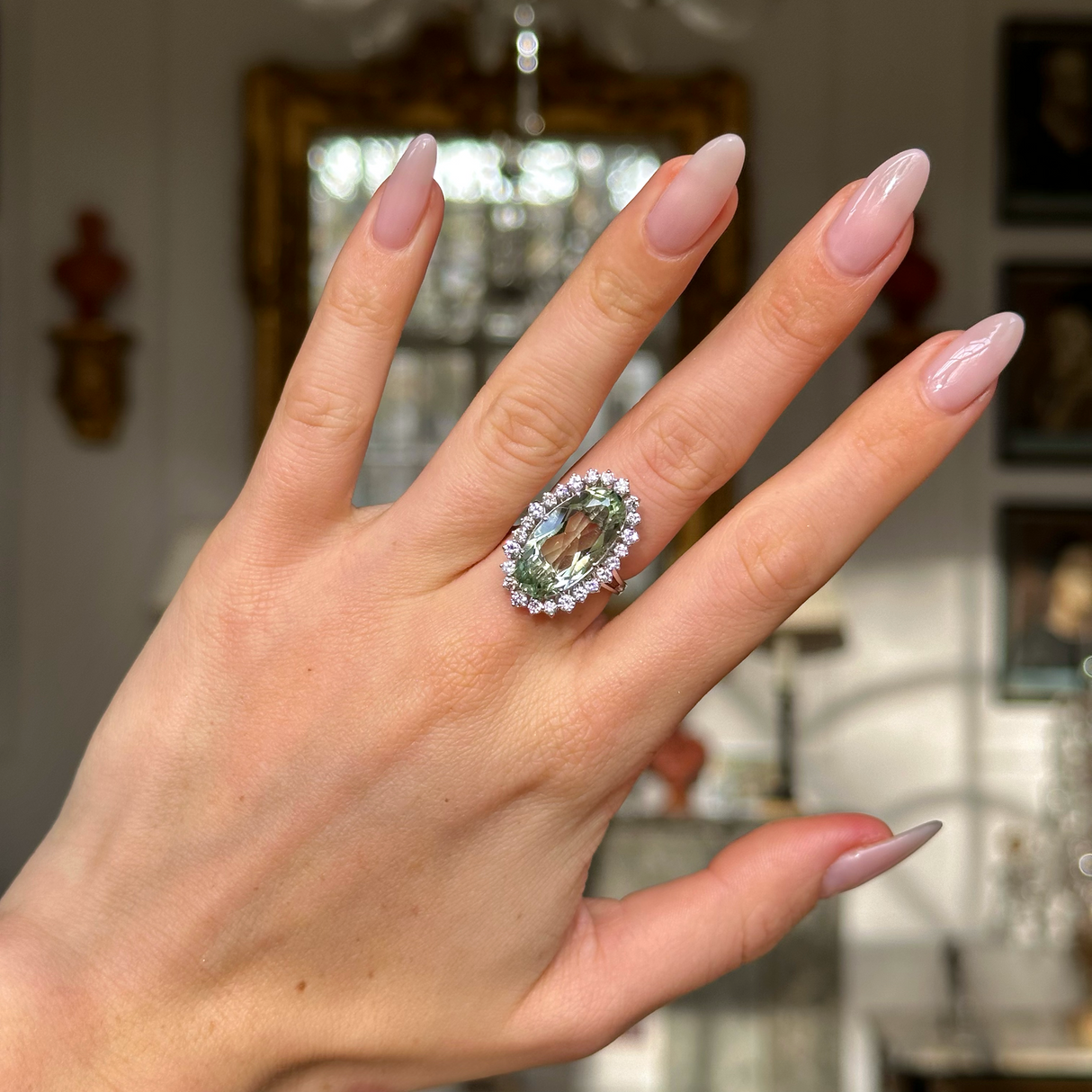 vintage mint green quartz and diamond cluster cocktail ring worn on hand.