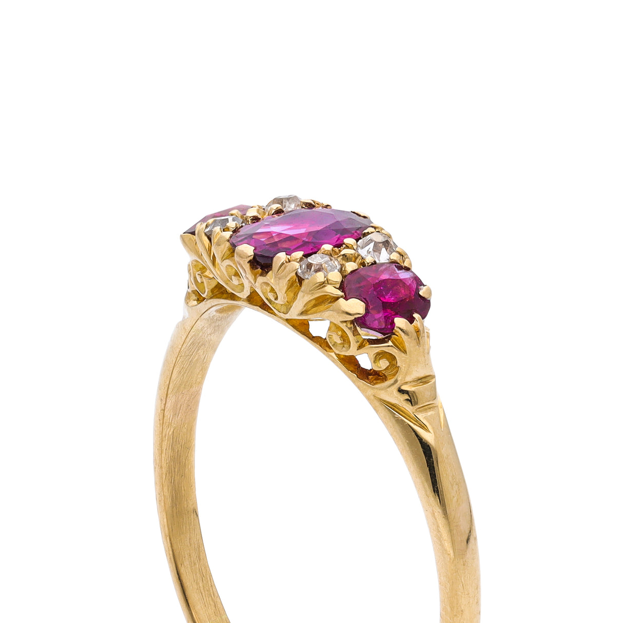 Antique Edwardian three stone ruby and diamond ring, side view.