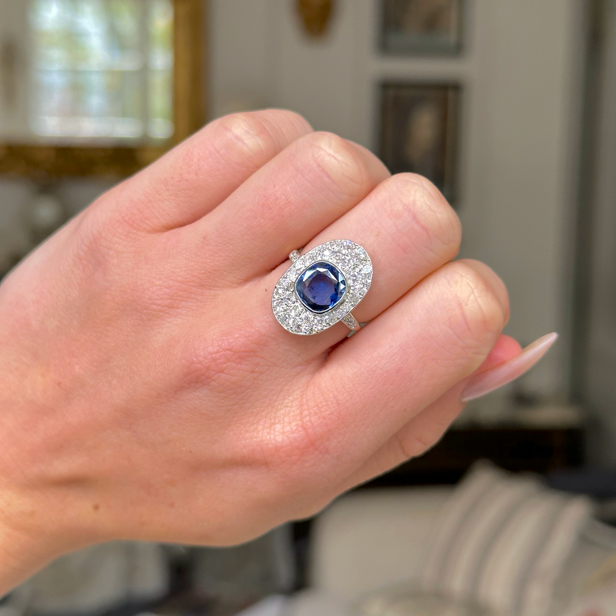 Edwardian sapphire and diamond ring, worn on hand.