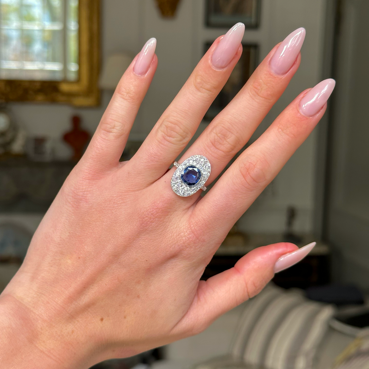 Edwardian sapphire and diamond ring, worn on hand.