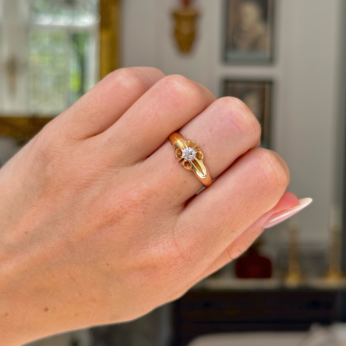 solitaire diamond engagement ring worn on closed hand