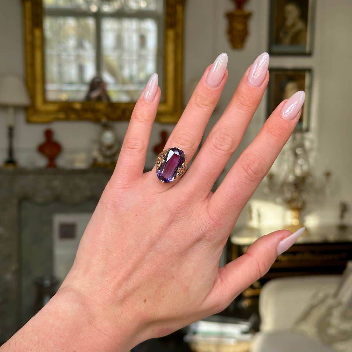 Victorian amethyst and 14ct yellow gold ring worn on hand.