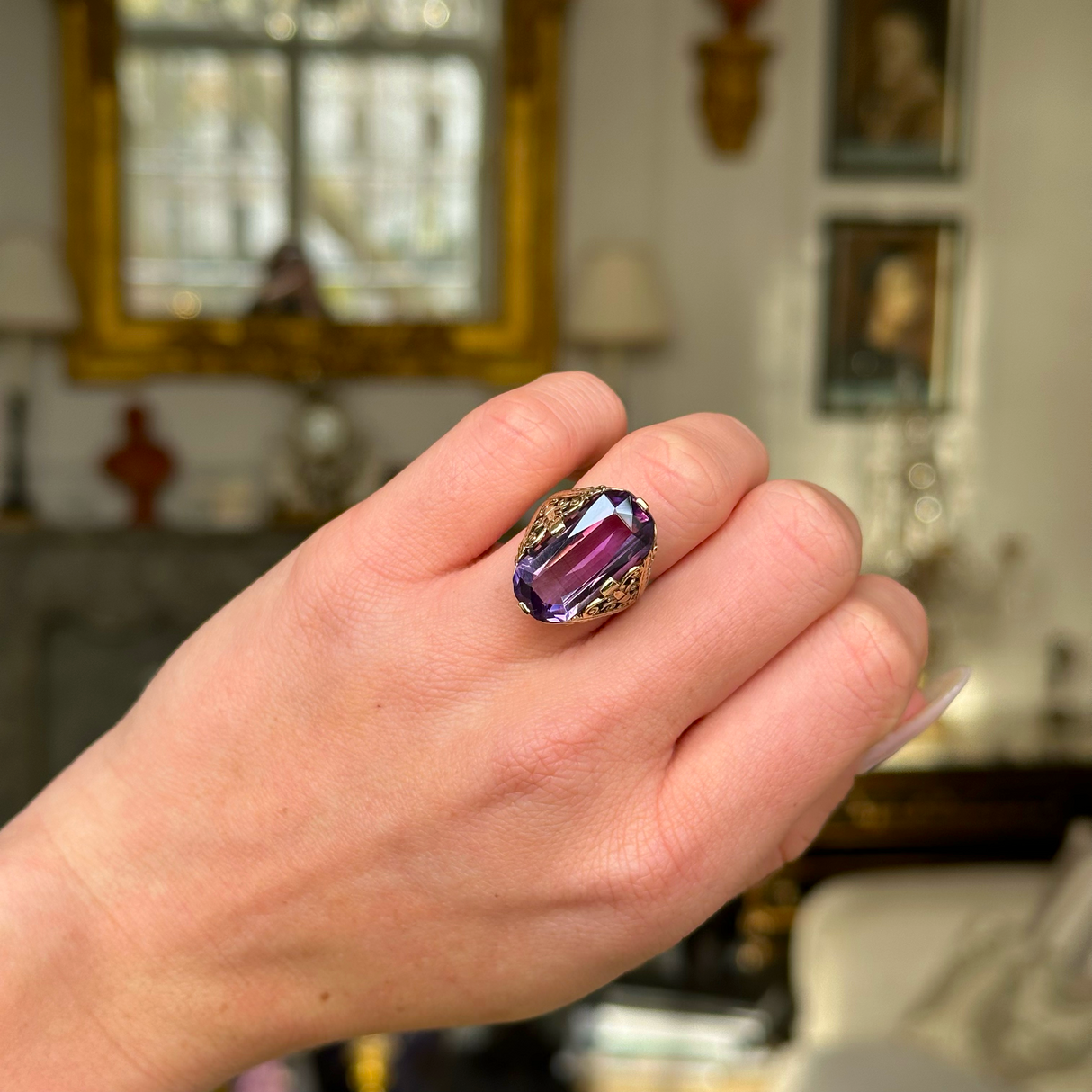 Victorian amethyst and 14ct yellow gold ring worn on closed hand.