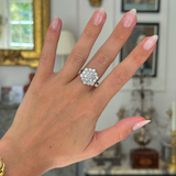 Vintage, large diamond cluster ring worn on hand.