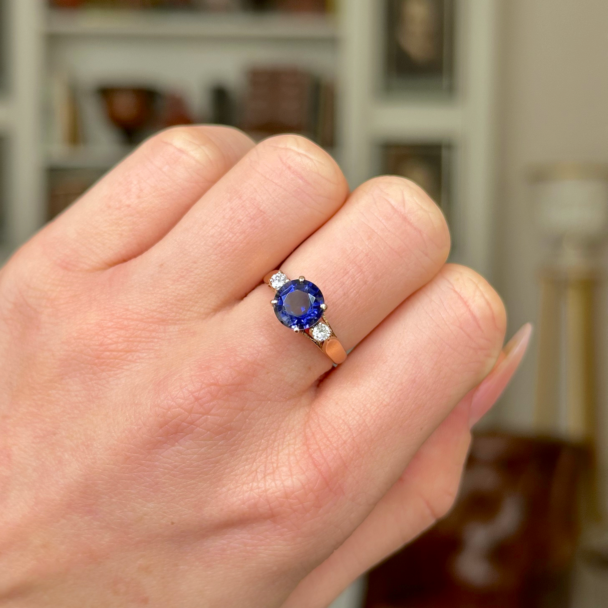 Vintage Iolite and Diamond Three-Stone Engagement Ring, 18ct Yellow Gold worn on closed hand.