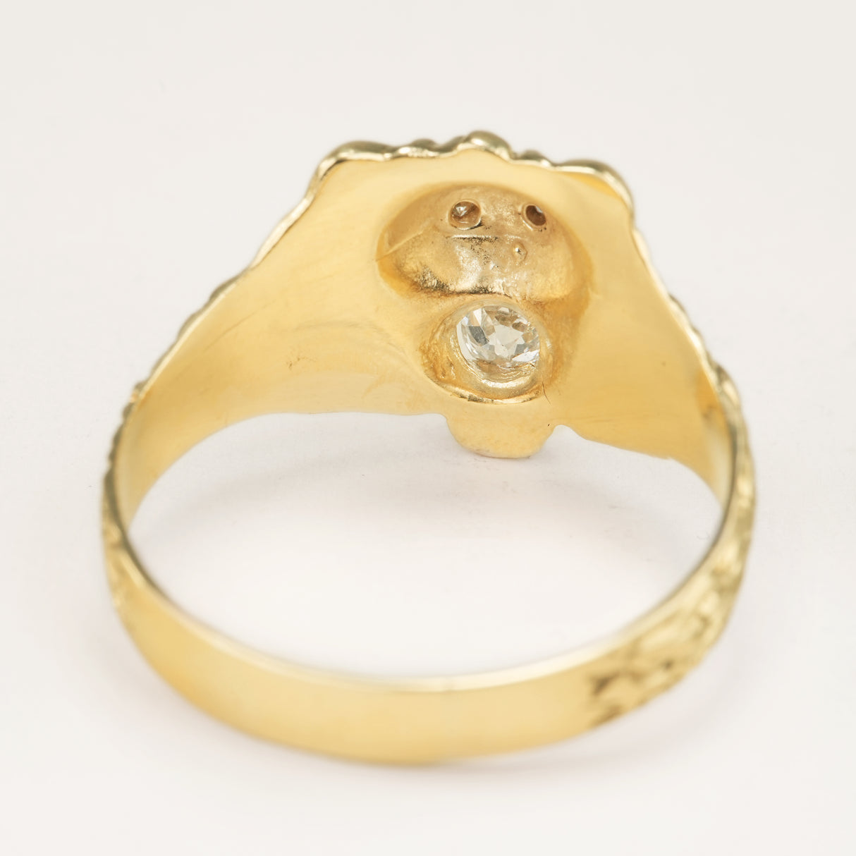 Vintage 1950s old-cut diamond lion’s head ring with diamond-set eyes placed backwards to show the inside of the band and setting