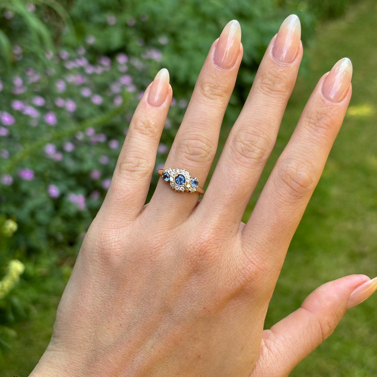 Vintage, 1950s sapphire and diamond cluster ring, 18ct yellow gold worn on hand